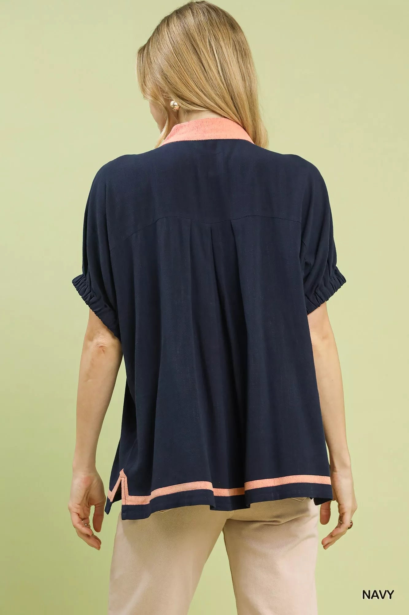 Navy blue Umgee linen V-neck blouse with peach trim collar and hem