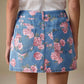 Floral print denim mini skirt with pink rose pattern on light blue fabric