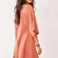 Davi & Dani soft peach draped sleeve ties back skort romper