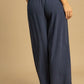 Navy blue wide-leg Umgee linen pants with dotted pattern and elastic waistband