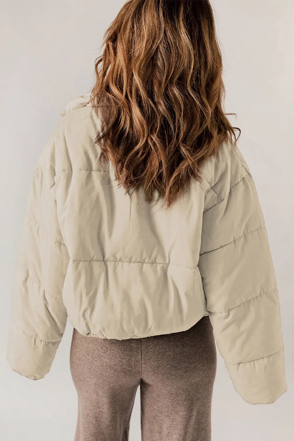 Beige zip-up collared puffer jacket with ruffled cropped sleeves