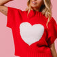 Vibrant red BiBi Rib Banded Heart Pattern Valentines Sweater with white heart applique