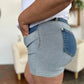 Back view of Judy Blue full size color block denim shorts with light-wash denim, dark blue pocket and silver hardware