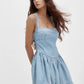 Daverri smocked crisscross back light blue denim mini dress