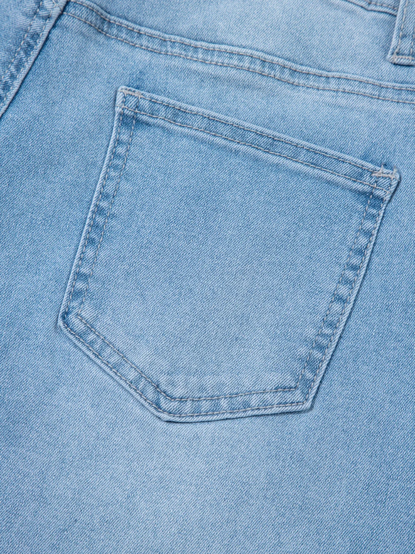 Light blue denim high rise barrel jeans pocket with stitching and logo