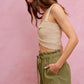 Beige crocheted crop top with twisted front on SO ME twill shorts