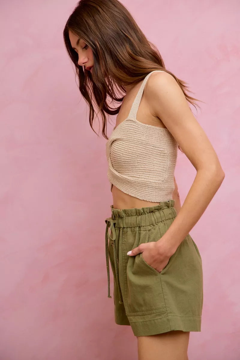 Beige crocheted crop top with twisted front on SO ME twill shorts