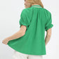 Vibrant green Umgee textured V-neck top with puffed sleeves and ruffled hem