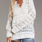 White loose-knit cover up with lace openwork and wooden button neckline
