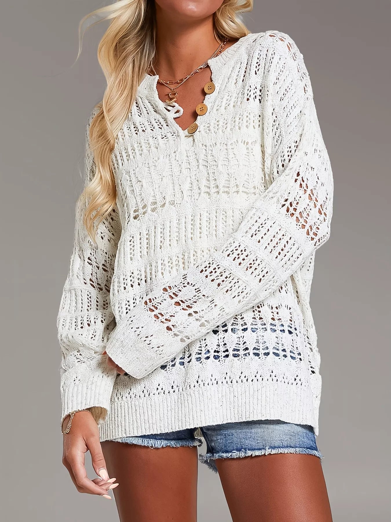 White loose-knit cover up with lace openwork and wooden button neckline