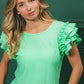 BiBi Birdseye Texture Layered Ruffle Top in mint green with textured fabric and short ruffled sleeves