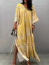 Flowing yellow and cream tie-dye V-neck maxi dress with wide sleeves and high slit