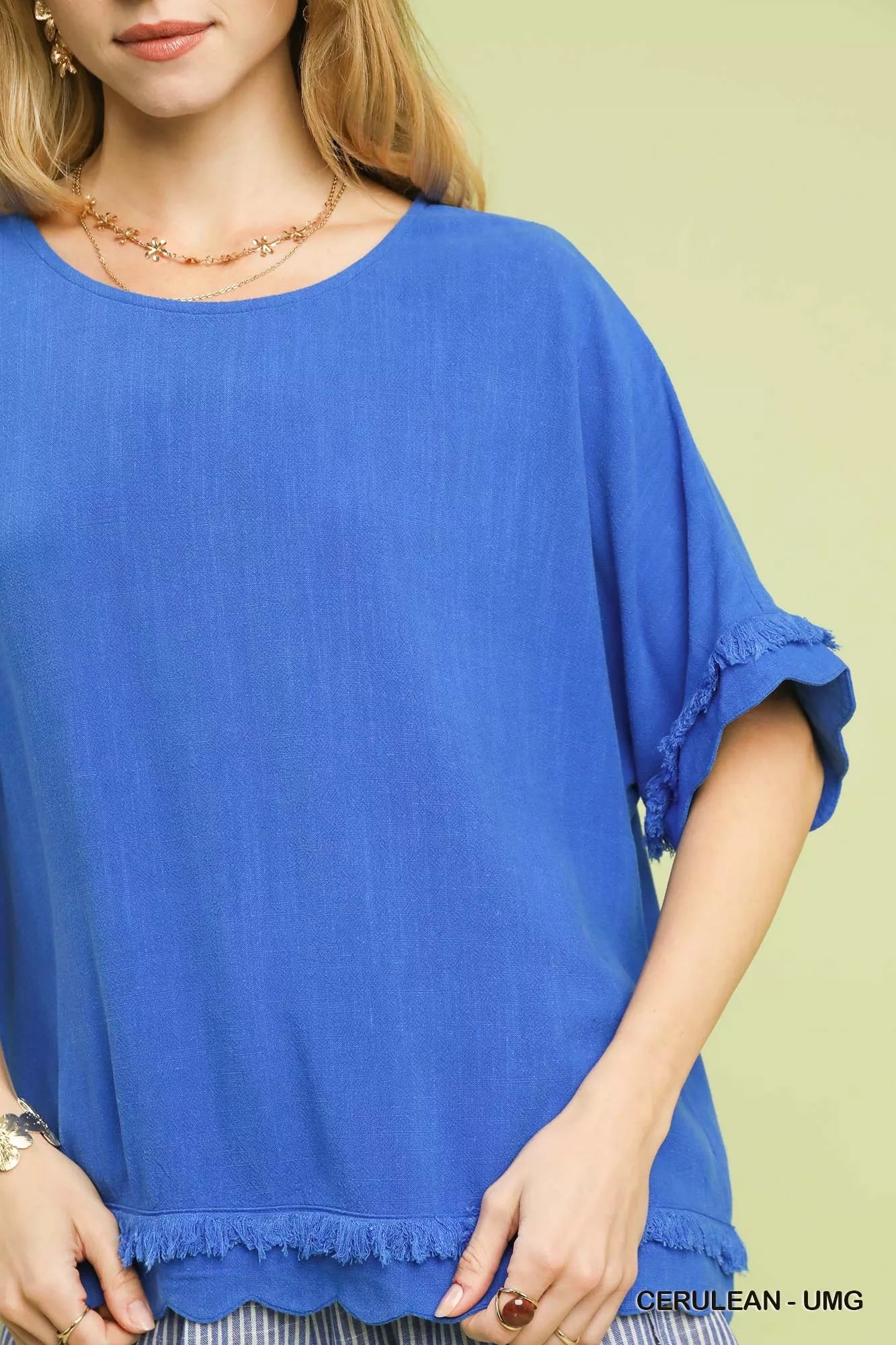Vibrant royal blue Umgee linen top with short sleeves and frayed scallop hem