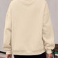 Cream-colored oversized mock neck dropped shoulder sweatshirt with ribbed cuffs and hem
