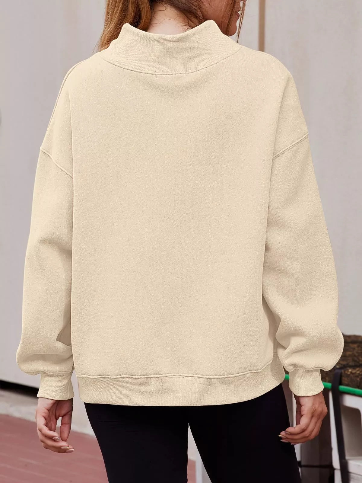 Cream-colored oversized mock neck dropped shoulder sweatshirt with ribbed cuffs and hem