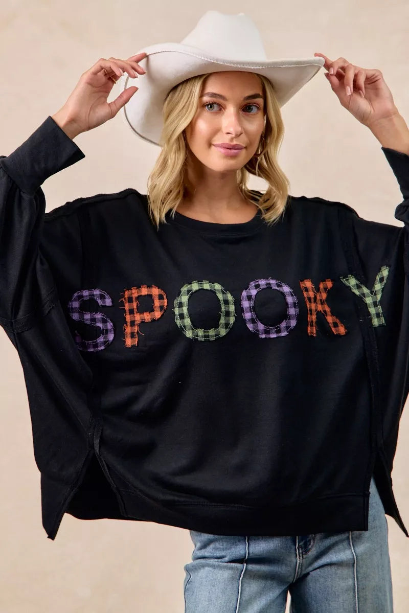 Black oversized BiBi Spook sweatshirt with colorful plaid spooky embroidery