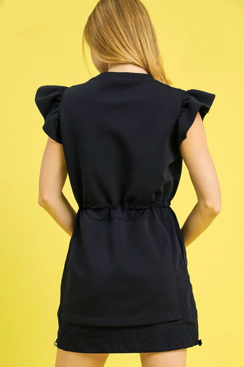 Umgee Luxe knit ruffle sleeve drawstring mini dress, black sleeveless with cinched waist