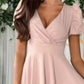 Surplice short sleeve midi dress in soft blush pink with deep V-neck