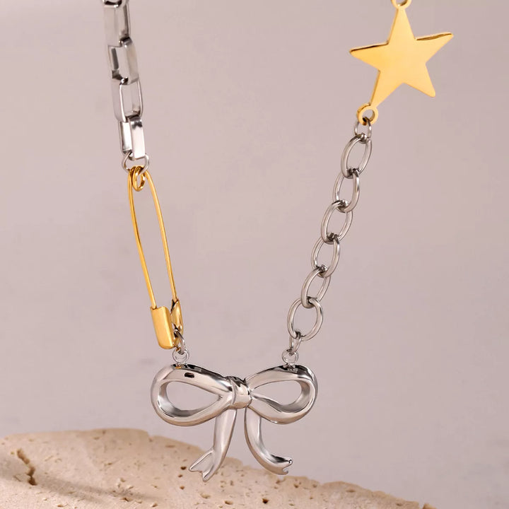 Two-Tone Stainless Steel Bow Star Necklace | Necklaces Daverri Fashions