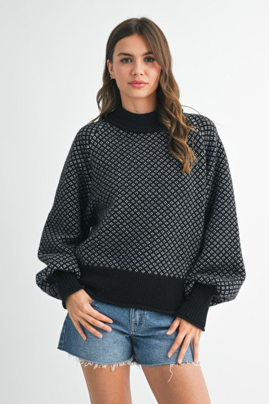 Black Aemi + Co Echo loose fit knit sweater with white geometric pattern