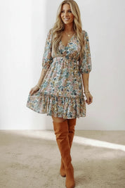 Floral printed V-neck mini dress with 3/4 sleeves and ruffled hem