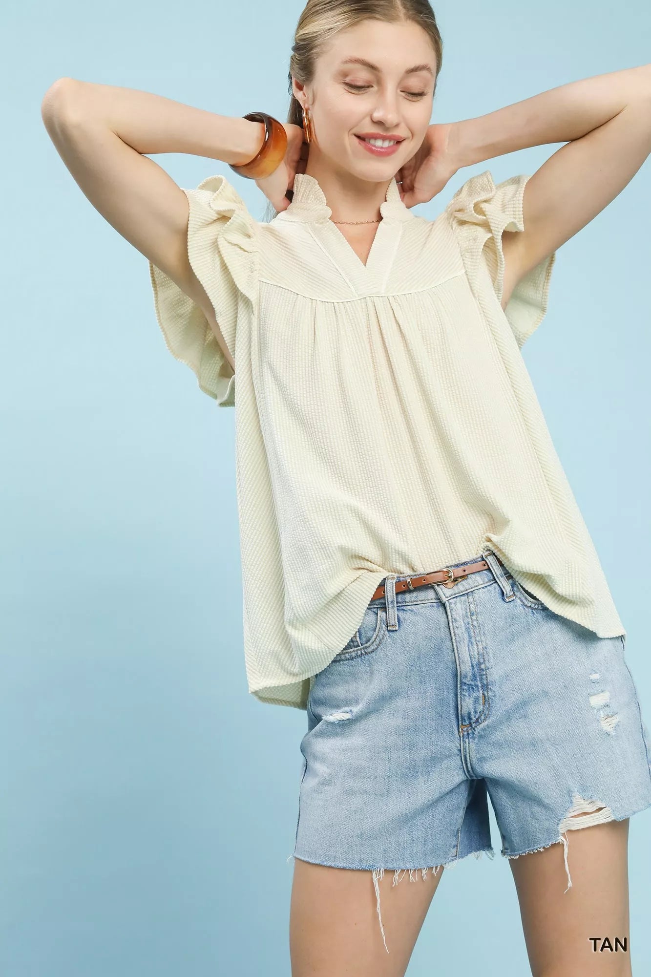 Umgee ruffled sleeve textured blouse in cream ribbed fabric