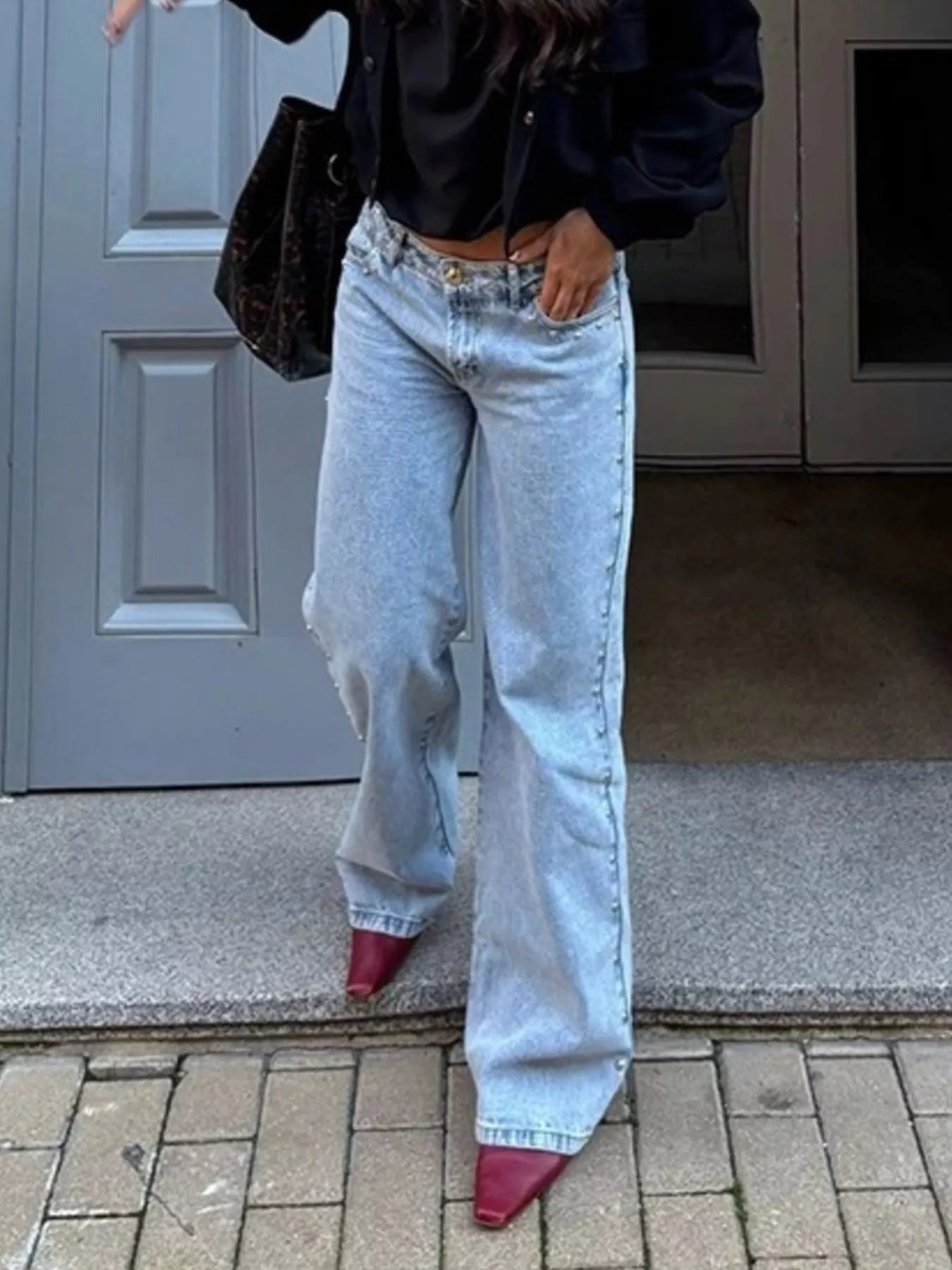 Leopard star patches on light-wash wide-leg tapered denim jeans