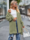 Olive green long sleeve waffle-knit cardigan with open shoulder design