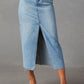 Light-wash denim midi skirt with front slit and frayed hem