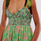 Vibrant green floral tiered maxi dress with smocked bodice and satin straps