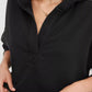 Exposed seam dropped shoulder hoodie in black with relaxed fit and v-neckline