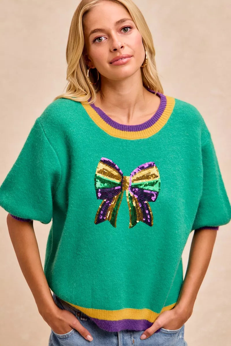 Emerald green BiBi Mardi Gras sequin bow knit sweater