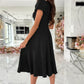 Surplice short sleeve midi dress in black with puffed sleeves and flared skirt