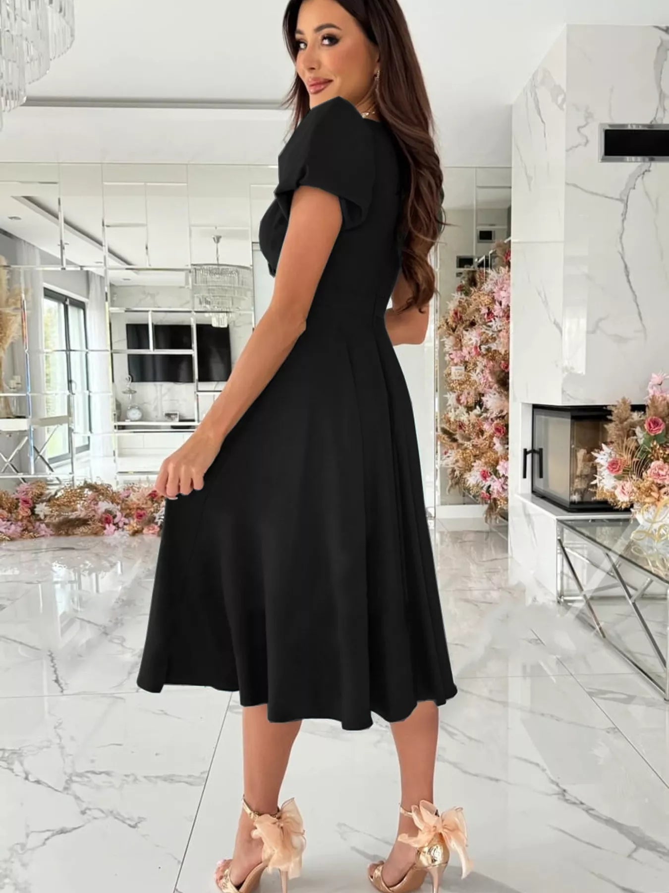 Surplice short sleeve midi dress in black with puffed sleeves and flared skirt