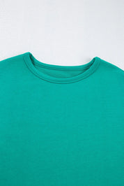 Teal crew neck t-shirt with ribbed neckline and short sleeves