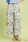 Cream-colored wide-leg Umgee Two Tone Floral Print Pants with blue floral pattern