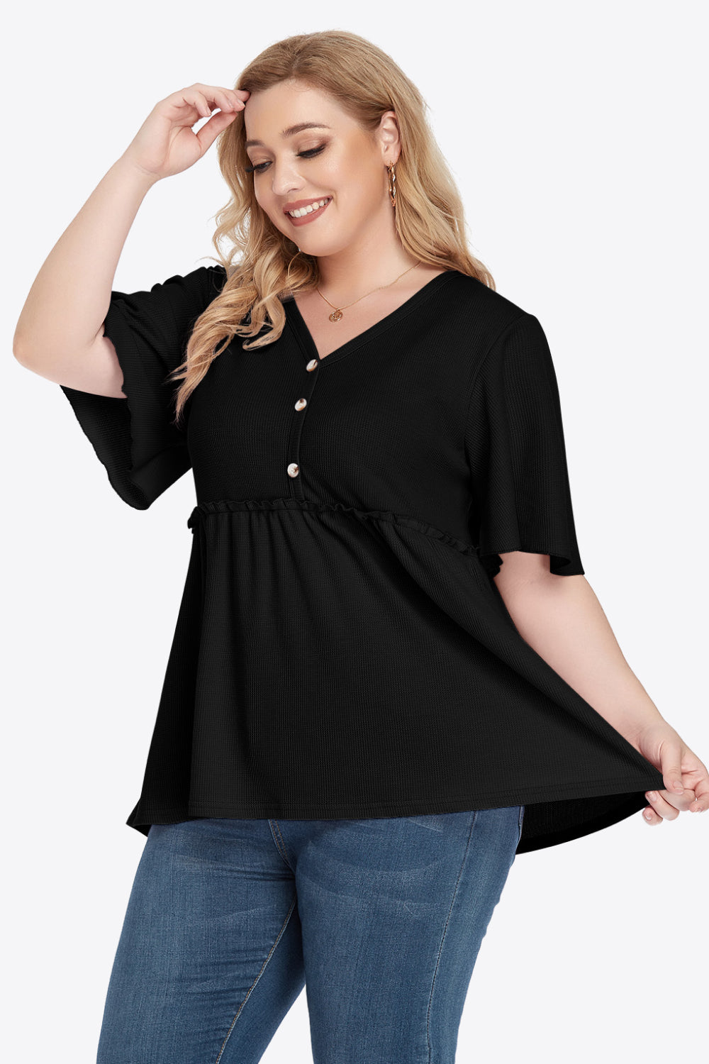 Plus size black V-neck babydoll blouse with bell sleeves and empire waist