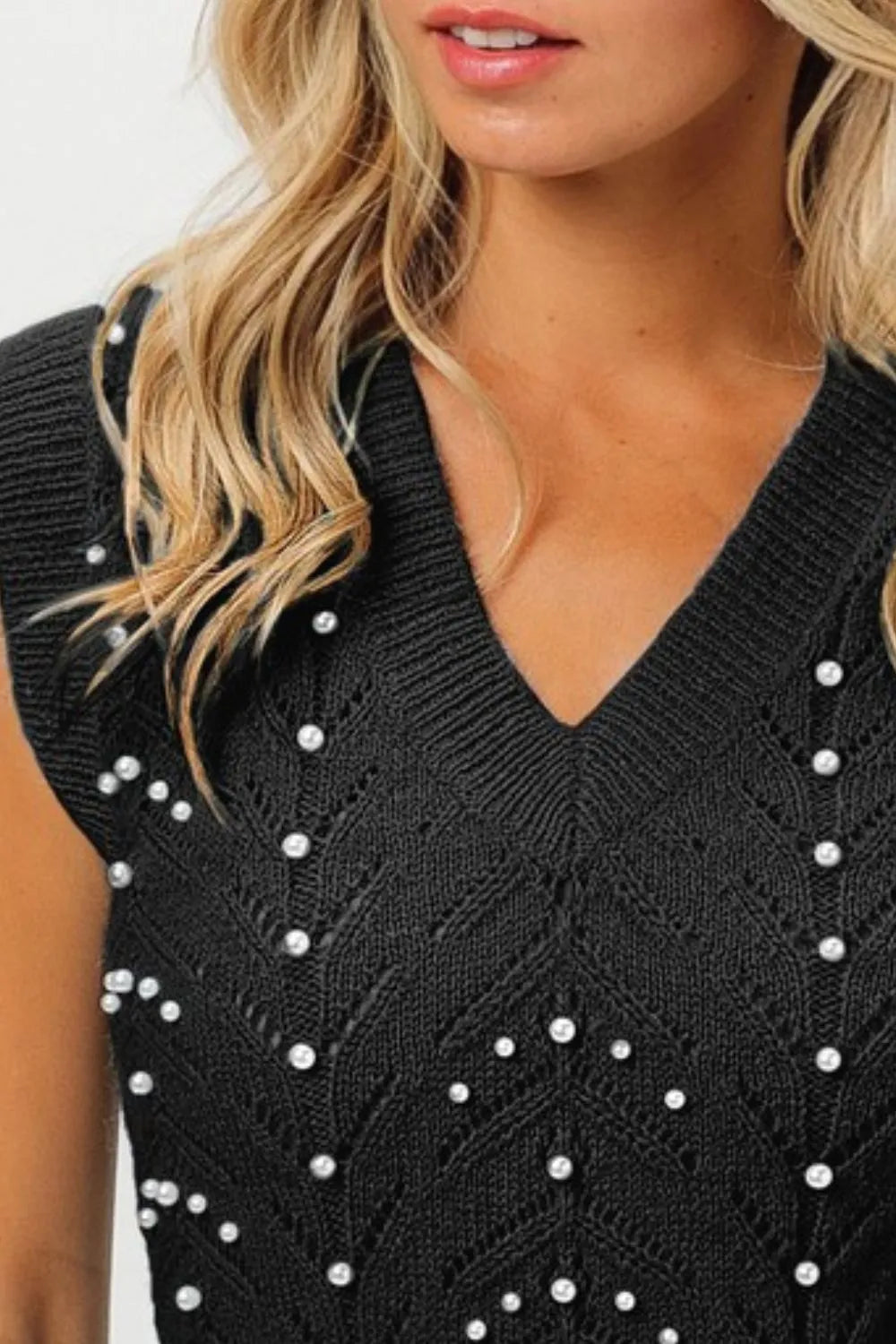 Black sleeveless BiBi Chevron Pointelle Pearl Knit Top with v-neck and white pearls