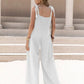 White sleeveless wide-leg jumpsuit with tie shoulder details