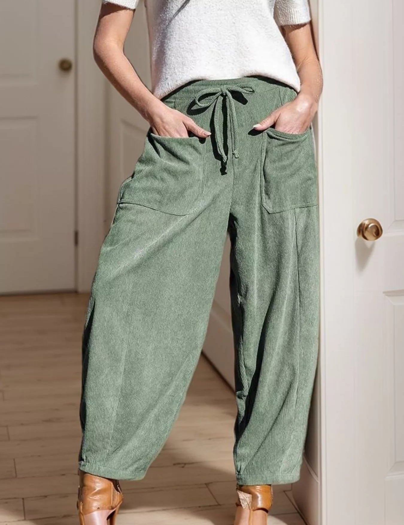 Olive green corduroy harem pants with drawstring waist and pockets