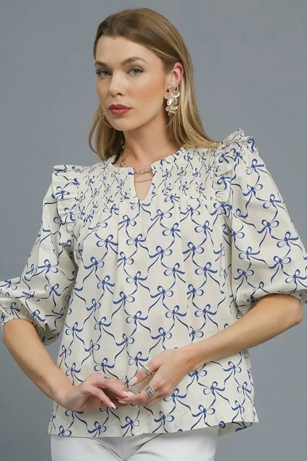Umgee Ruffled Bow Print Notched Blouse - DAVERRI FASHIONS