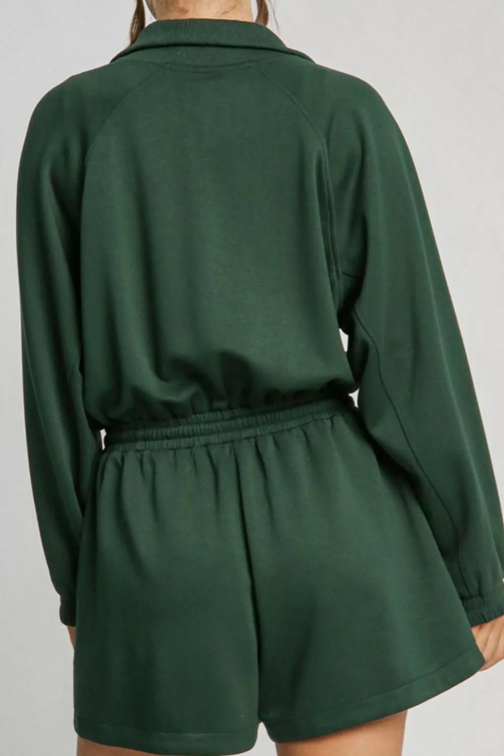 Dark green zip-up drawstring waist romper back view