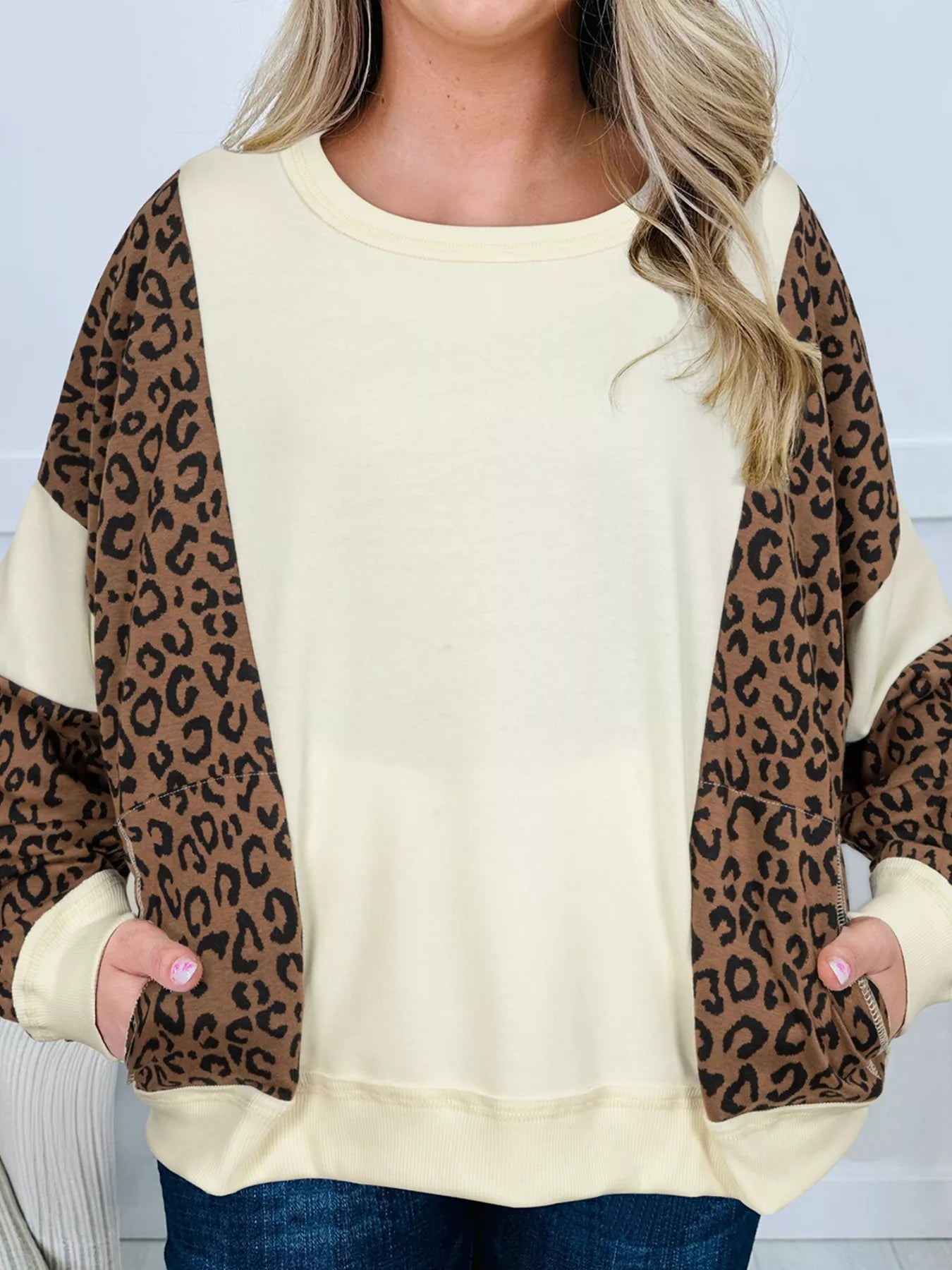 Leopard round neck sweatshirt in cream with print sleeves and pockets