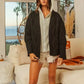 Black cable-knit BiBi Knit Hoodie Rhombus Sweater Jacket over gray hoodie and white shorts