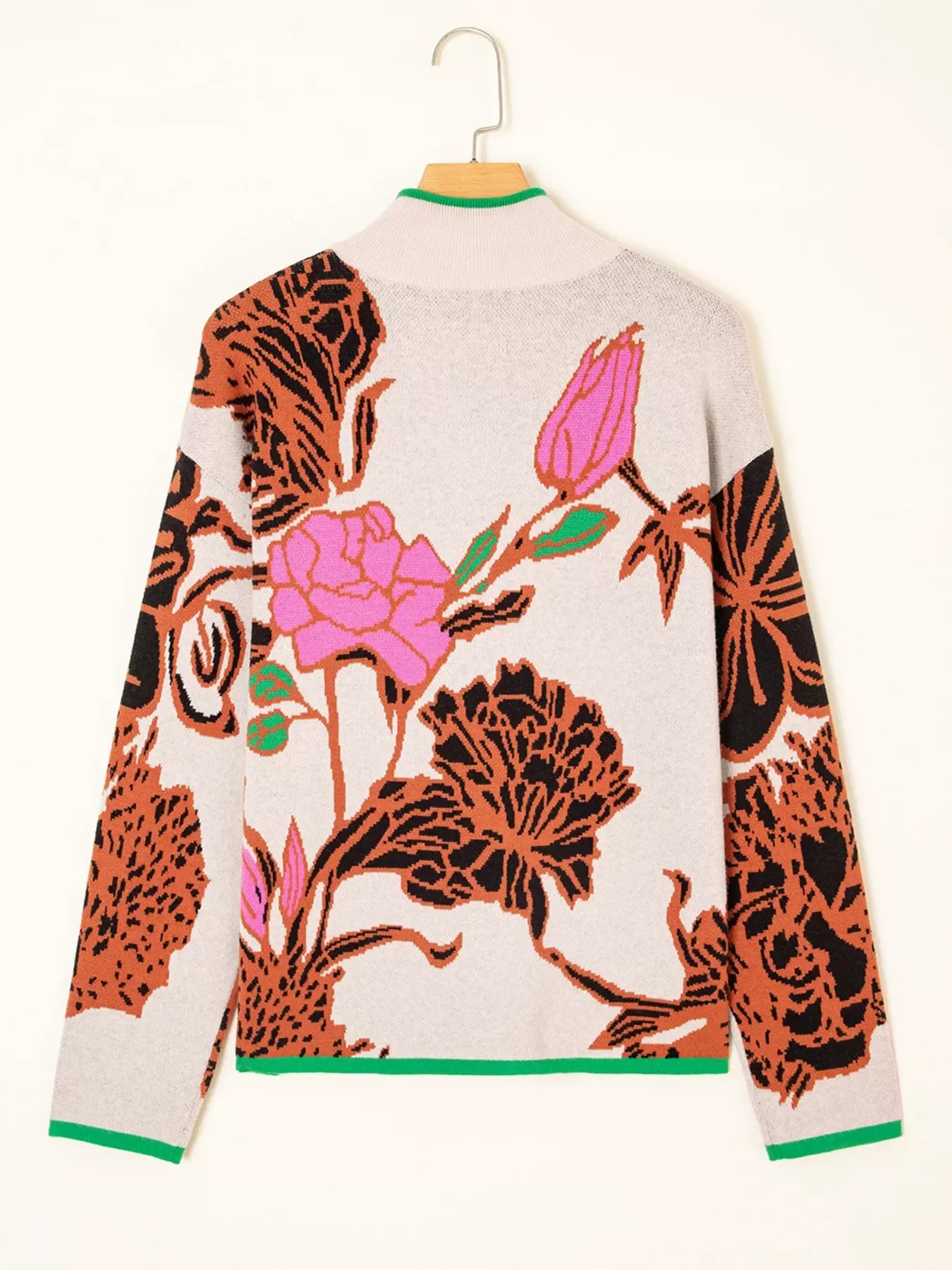 Floral print knit quarter zip sweater with green trim and leopard details