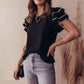 Black ruffled short-sleeve textured blouse with white striped contrast trim