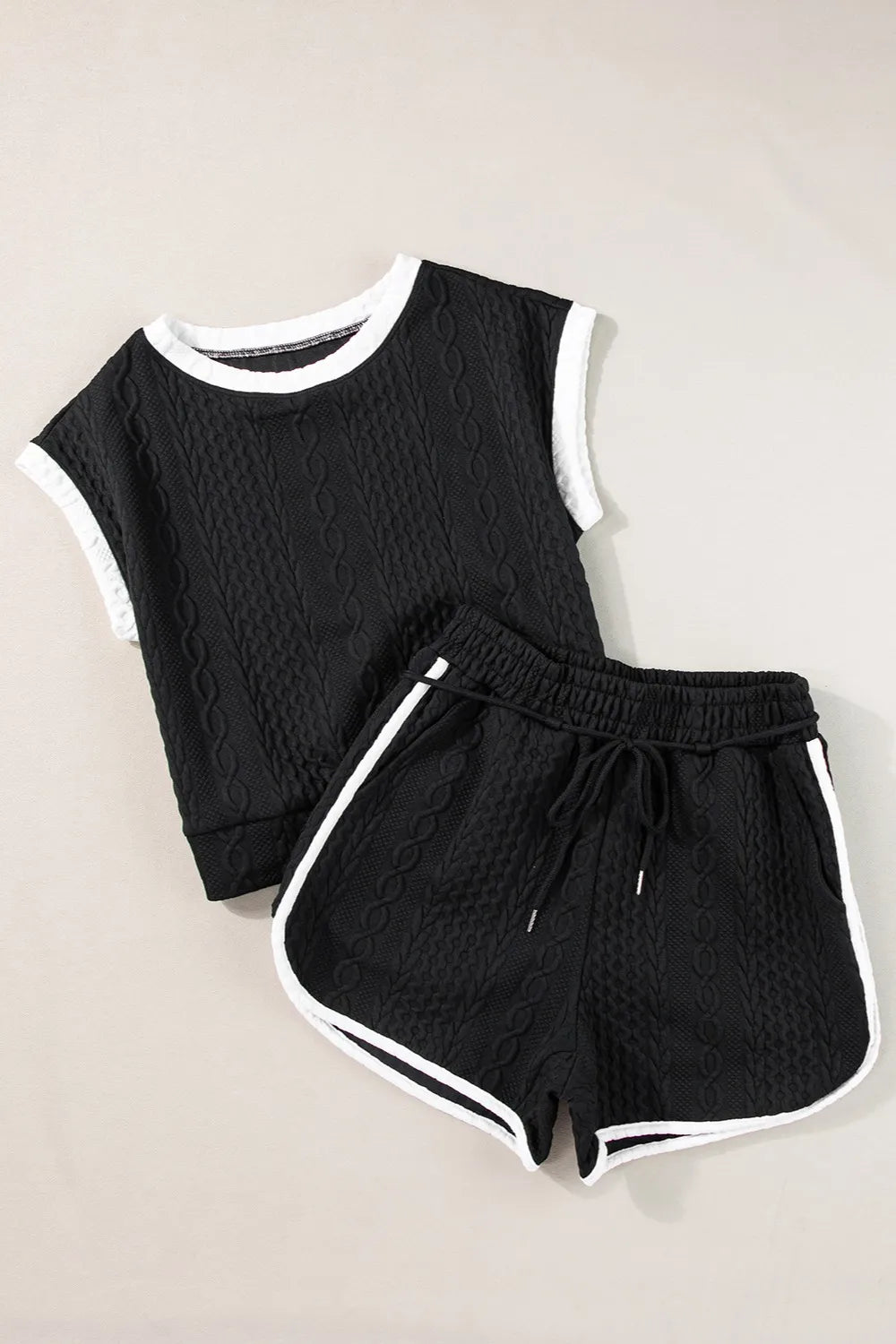 Black cable-knit cropped top and shorts set with white contrast trim