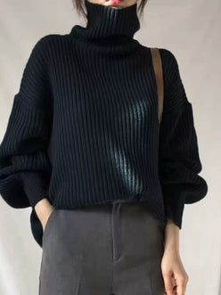 Black ribbed knit turtleneck sweater with voluminous sleeves