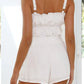 Daverri white ruffled strap romper with fitted waistband back view
