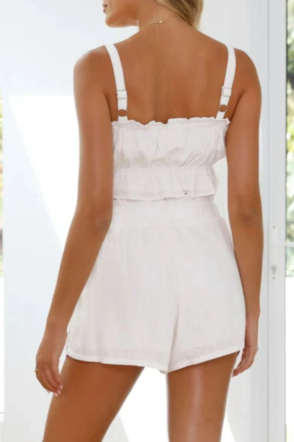 Daverri white ruffled strap romper with fitted waistband back view
